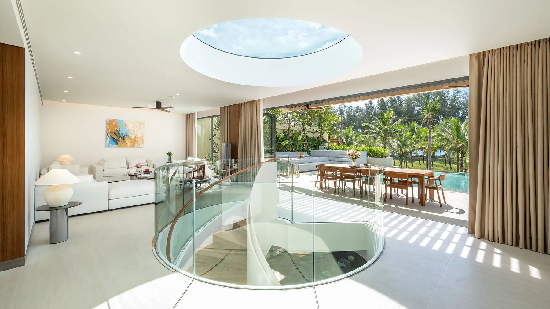 Banyan Tree Beach Residences Aegir 一栋别墅上层客厅的效果图:螺旋楼梯上方的圆形天窗,外面是露台与泳池