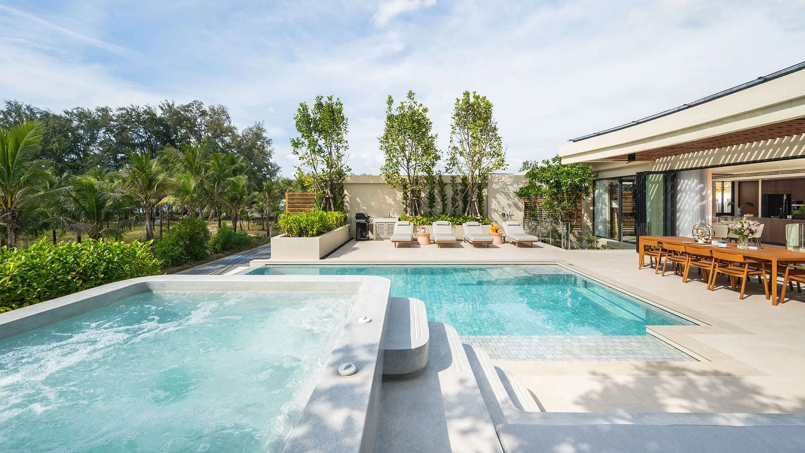 Computer-generated render of the jacuzzi and pool on a villa terrace at Banyan Tree Beach Residences Aegir, palms and the garden around it