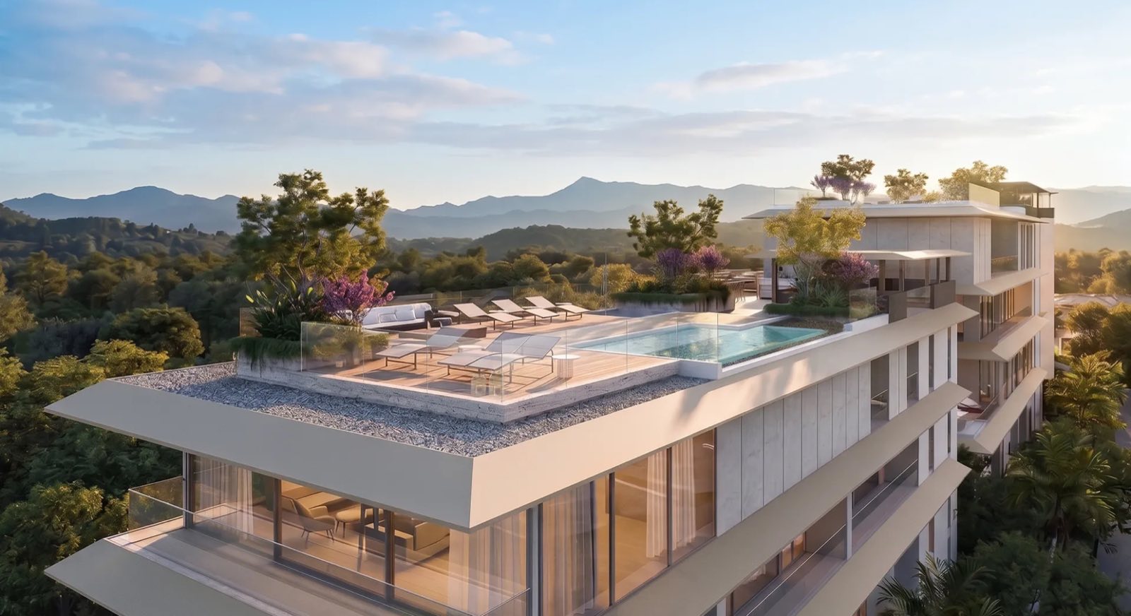 ภาพจำลองที่สร้างด้วยคอมพิวเตอร์ของดาดฟ้าเพนท์เฮาส์ที่ Banyan Tree Beach Residences Nerea จากมุมสูง เด็คไม้พร้อมเตียงพักผ่อน สระตามแนวขอบด้านหนึ่ง ต้นไม้ที่มุม และเนินเขาของภูเก็ตไกลออกไป
