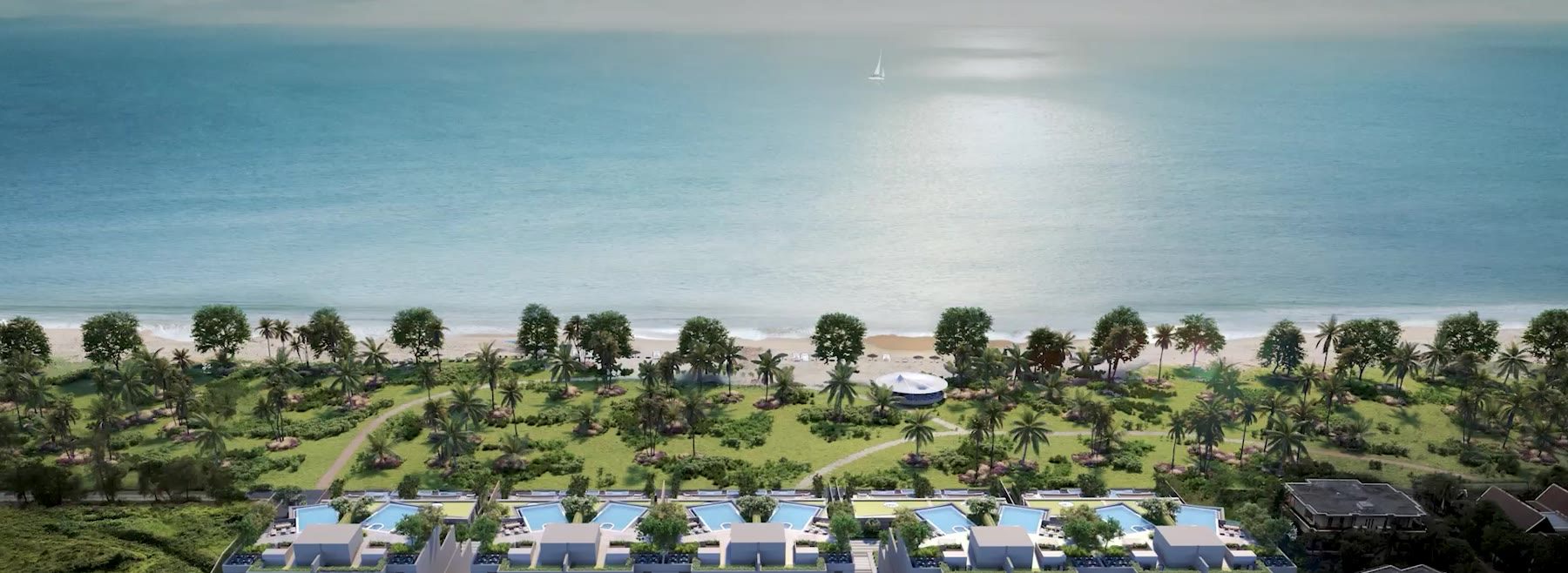 Computer-generated still from the developer's film of Banyan Tree Beach Residences Sirena at dusk, the row of buildings with lit pools seen from over the sea