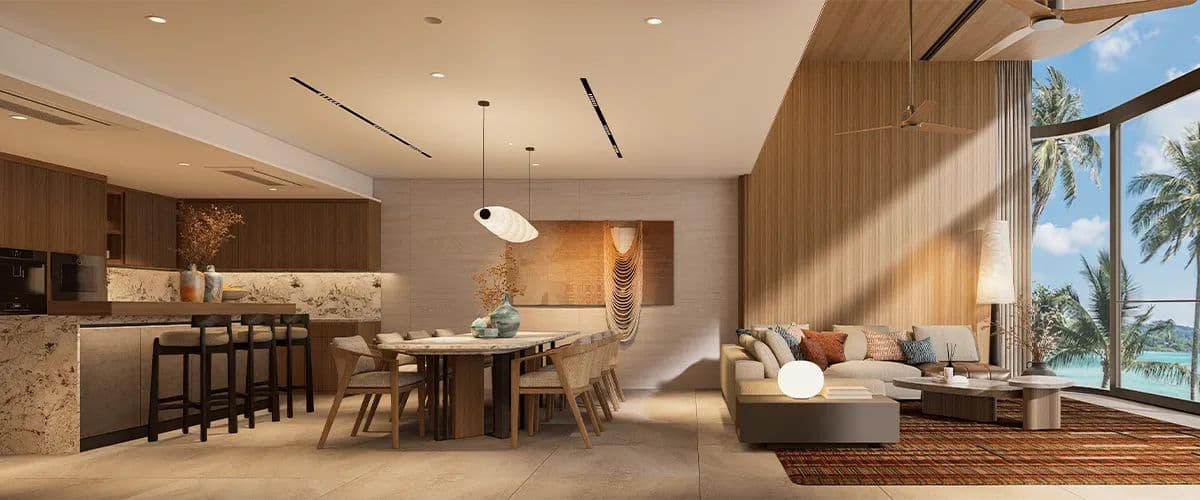 Computer-generated render of the third-floor living, dining and kitchen of a Banyan Tree Beach Residences Varuna townhome, full-height glass to the sea