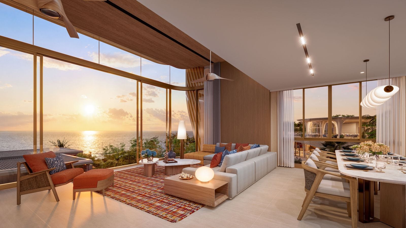 ภาพจำลองห้องนั่งเล่นและรับประทานอาหารของทาวน์โฮมที่ Banyan Tree Beach Residences Varuna ยามพระอาทิตย์ตก