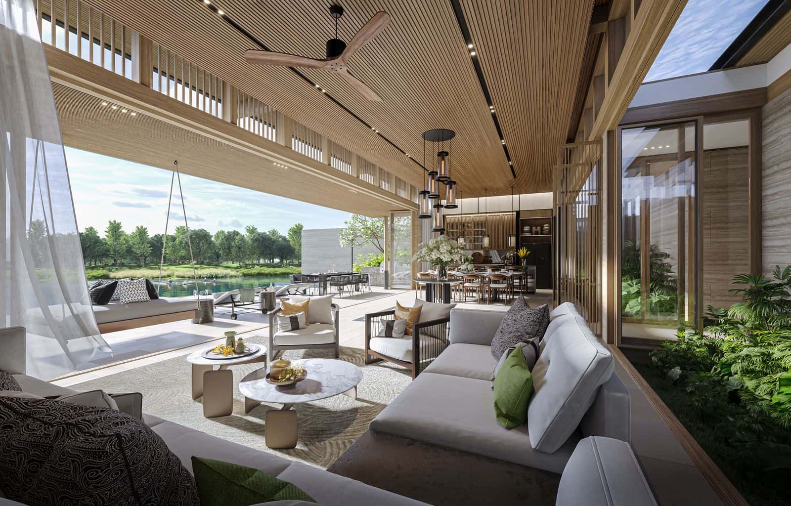 ภาพจำลองห้องนั่งเล่นของวิลล่าสามห้องนอนที่ Banyan Tree Lake Residences Yara เปิดออกสู่ลานและลากูน มีเก้าอี้ชิงช้าแขวน