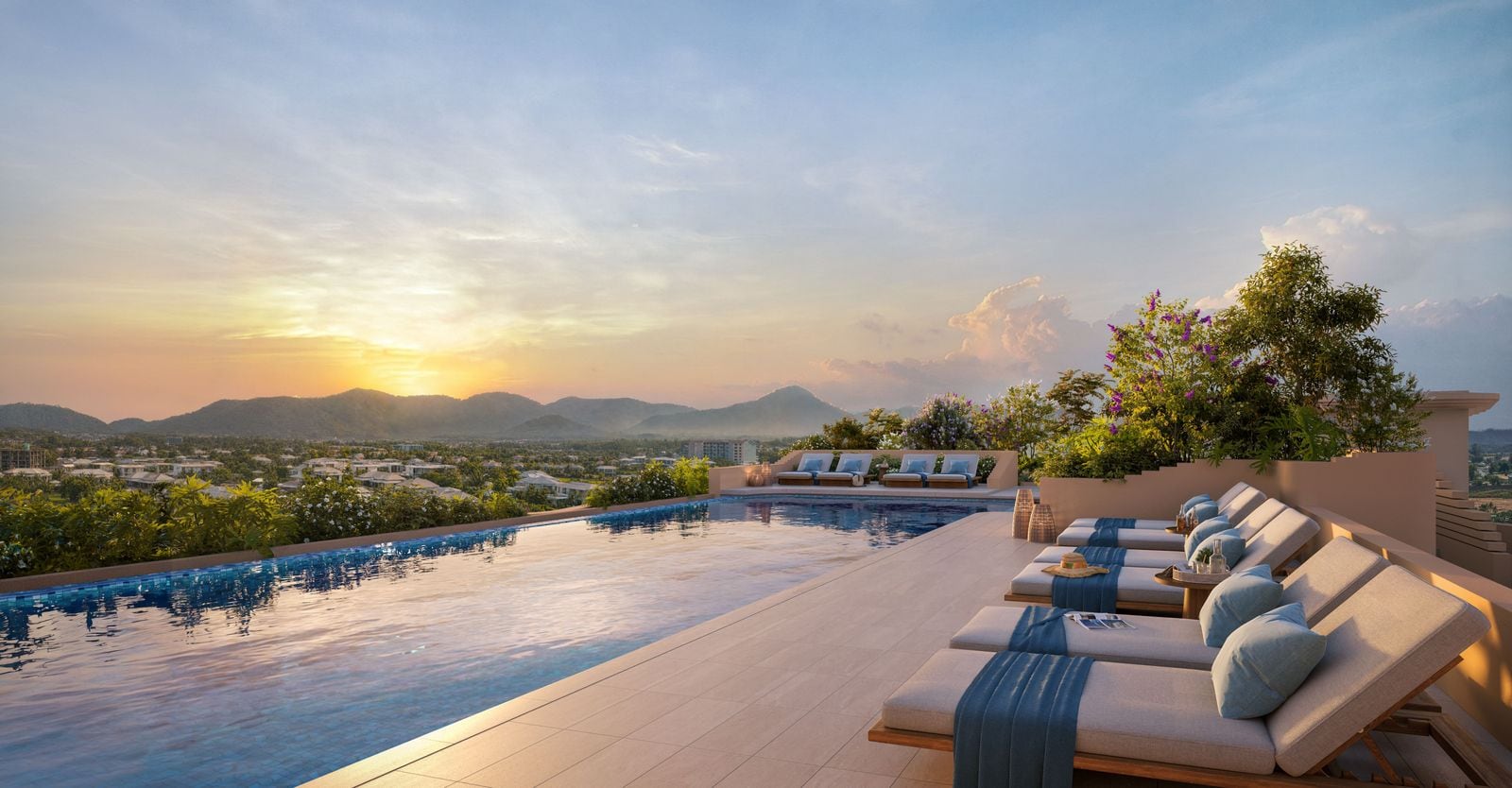 ภาพจำลองสระว่ายน้ำส่วนกลางบนดาดฟ้าของ Bellaguna Golf Residences ยามพระอาทิตย์ตก มีเก้าอี้อาบแดดเรียงริมสระ และเนินเขาของภูเก็ตอยู่ไกลออกไป
