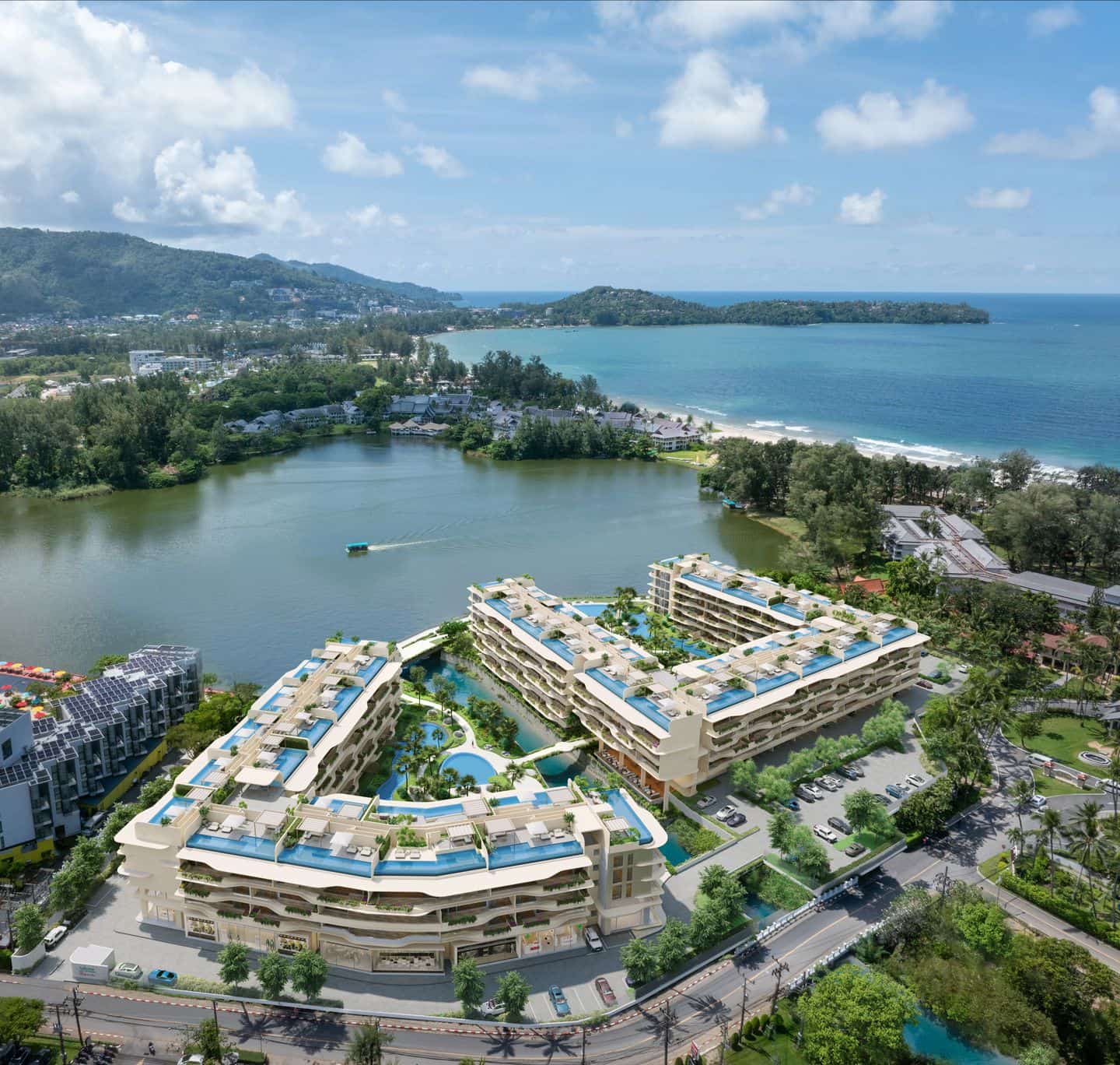 從道路一側看 Laguna Beach Residences Bayside 兩座大樓的高空電腦效果圖:運河與泳池位於兩座大樓之間,後方是潟湖,地平線上是大海