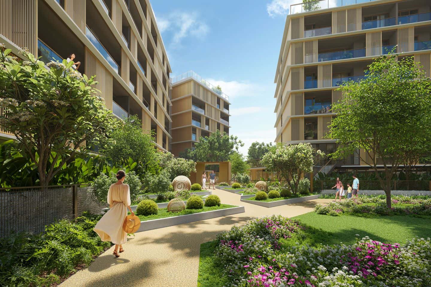 Laguna Lake Residences Aster 大樓之間花園小徑的電腦效果圖:草坪與植栽之間有住戶散步
