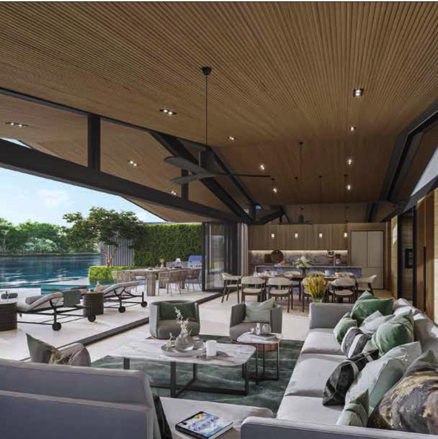 The living pavilion of a Lakelands Waterfront Villa at Laguna Phuket opening onto its private pool and the lagoon beyond, on the freshwater side of the estate