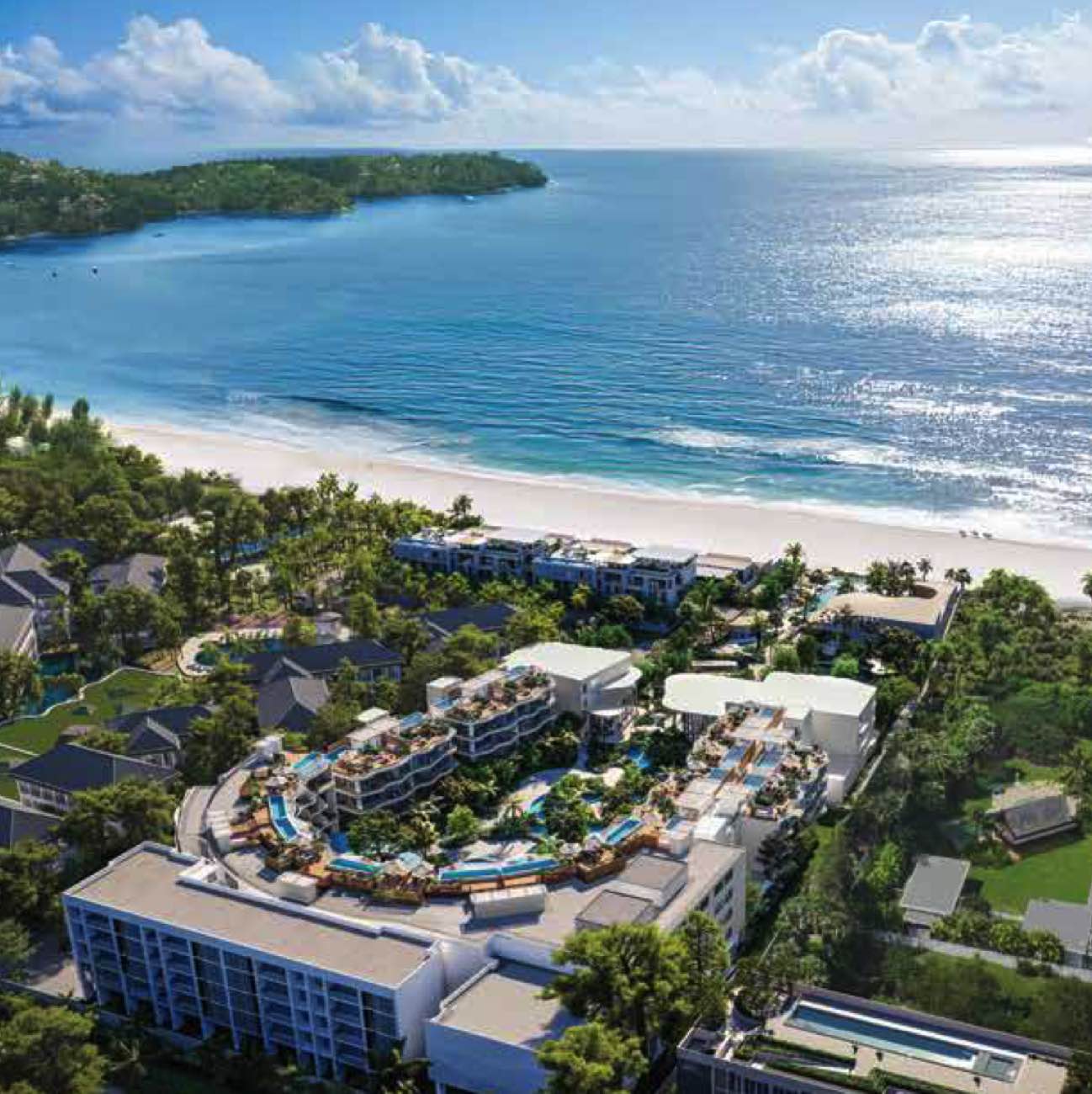 Residences at Garrya Phuket from the air, the low buildings set behind the tree line on the Bang Tao shore inside Laguna Phuket, one of the four Banyan Group brands that carry homes on the estate