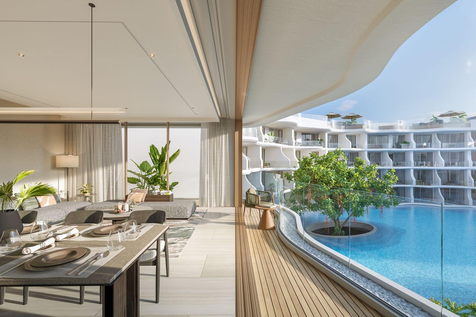 Residences at Garrya Phuket 兩房住宅用餐區的電腦效果圖:餐桌已擺好晚餐,旁邊是俯瞰潟湖泳池的弧形露台