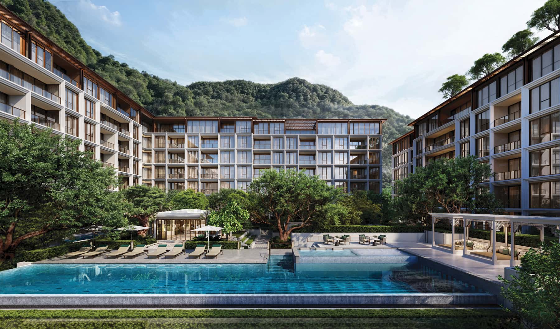 Computer-generated render of The Residences at InterContinental Phuket Resort: two seven-storey buildings around the 25-metre lap pool with the Kamala hills behind