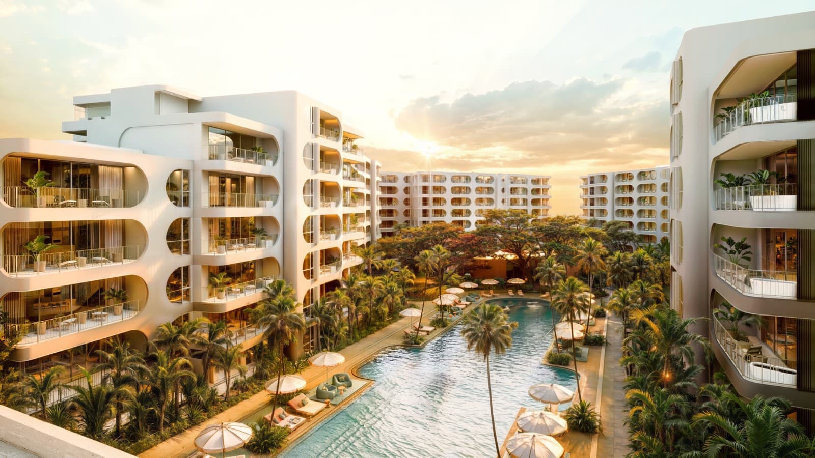Computer-generated evening render of The Standard Residences, Phuket Bang Tao, from above: curved white buildings around a long pool and gardens