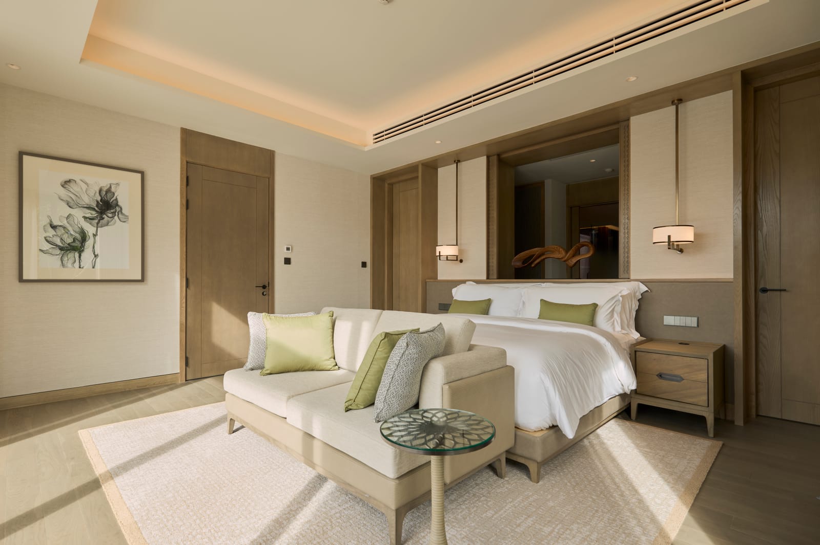 A bedroom of the Vana 4 show villa at Tri Vananda, Phuket, in pale wood and linen