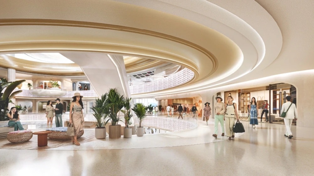 Central Pattana's render of the luxury concourse in the expanded Central Phuket Floresta, with boutique frontages along a pale stone walkway and shoppers