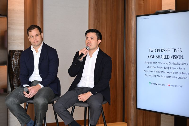 Two speakers seated beside a screen reading Two perspectives, one shared vision, with the City Realty and Swire Properties logos, at the Upper House Residences presentation in Bangkok