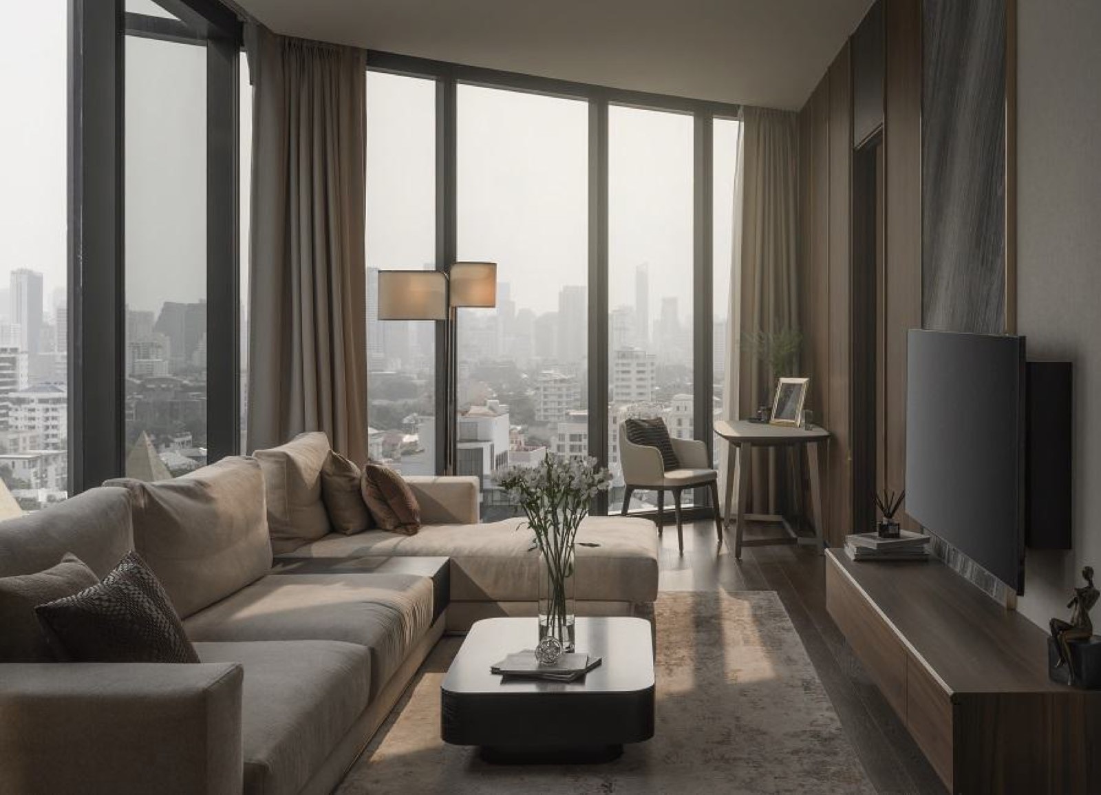 AESTIQ Thonglor: Residence living room with sectional sofa, floor-to-ceiling windows and a misty city view