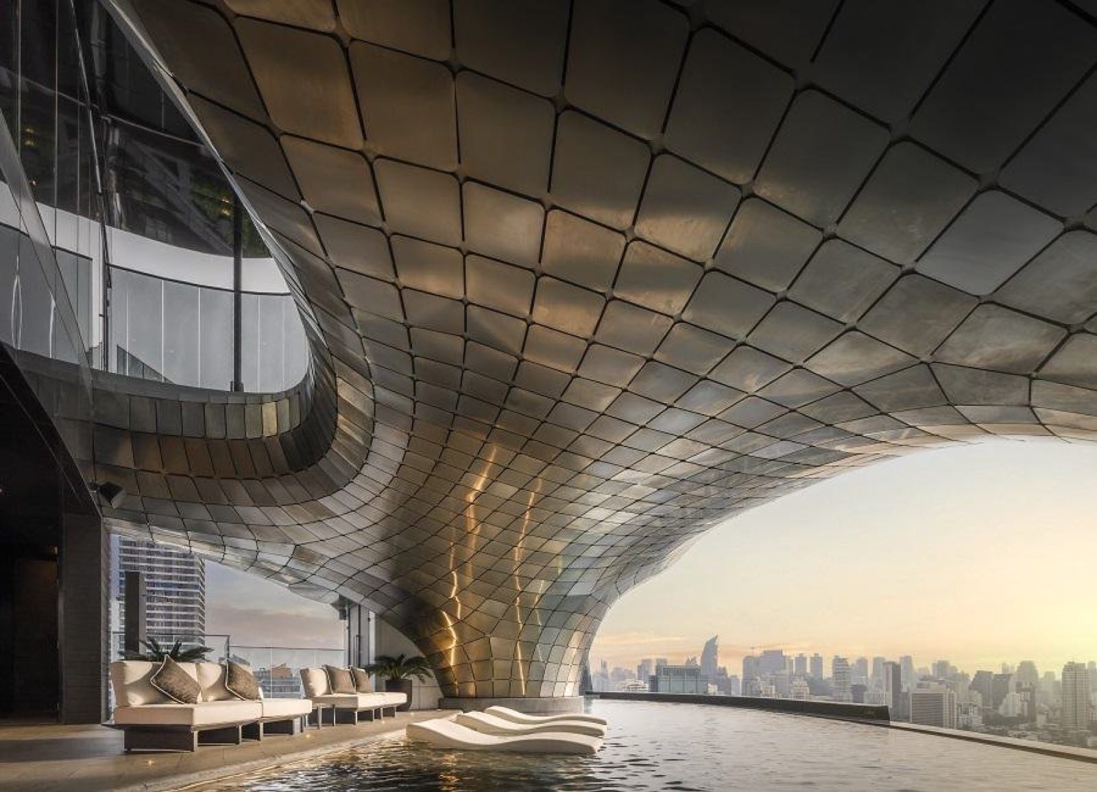 AESTIQ Thonglor: Rooftop pool lounge beneath the sculptural gold tessellated canopy at sunset