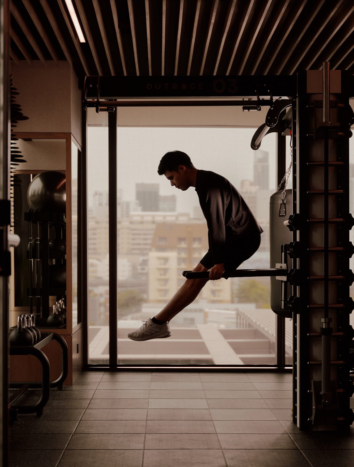 Aman Nai Lert Residences: Fitness centre with strength equipment and floor-to-ceiling windows overlooking the city at Aman Nai Lert Bangkok