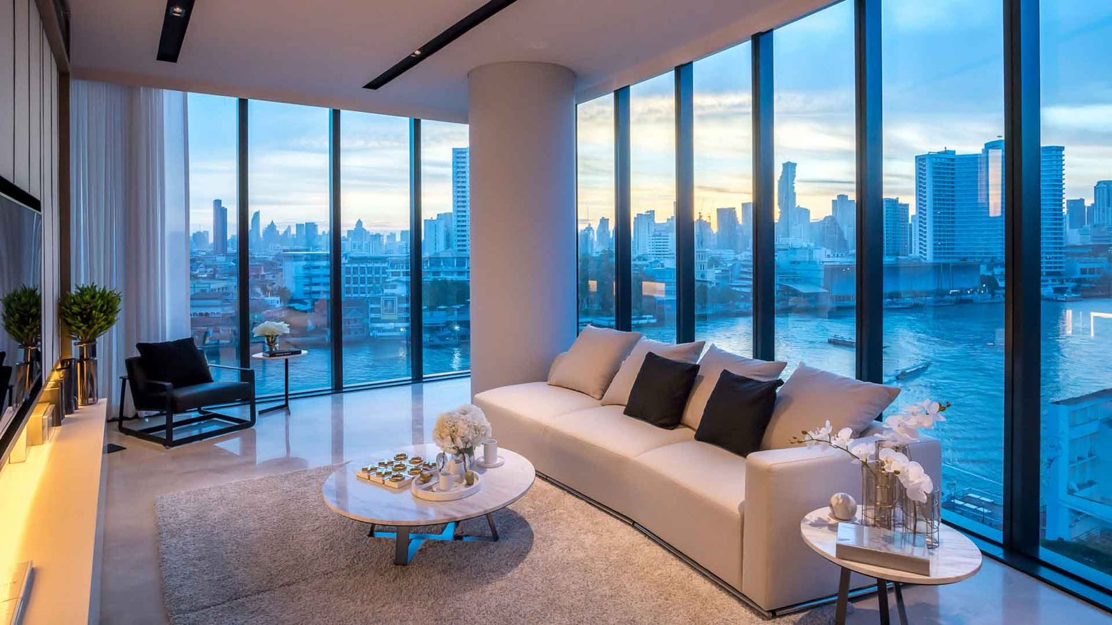 Banyan Tree Residences Riverside Bangkok: residence living room with floor-to-ceiling windows and riverside city view