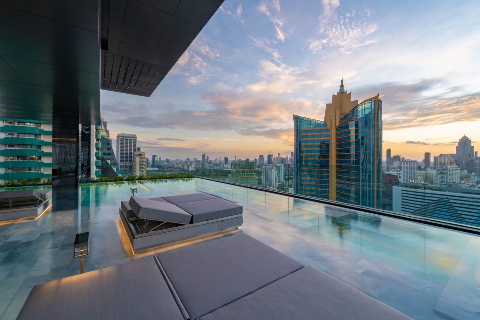 Celes Asoke: rooftop infinity pool at sunset with skyline