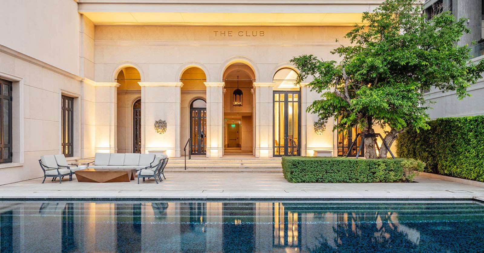 The Diplomat 39: The Club arrival pavilion and reflecting pool at dusk
