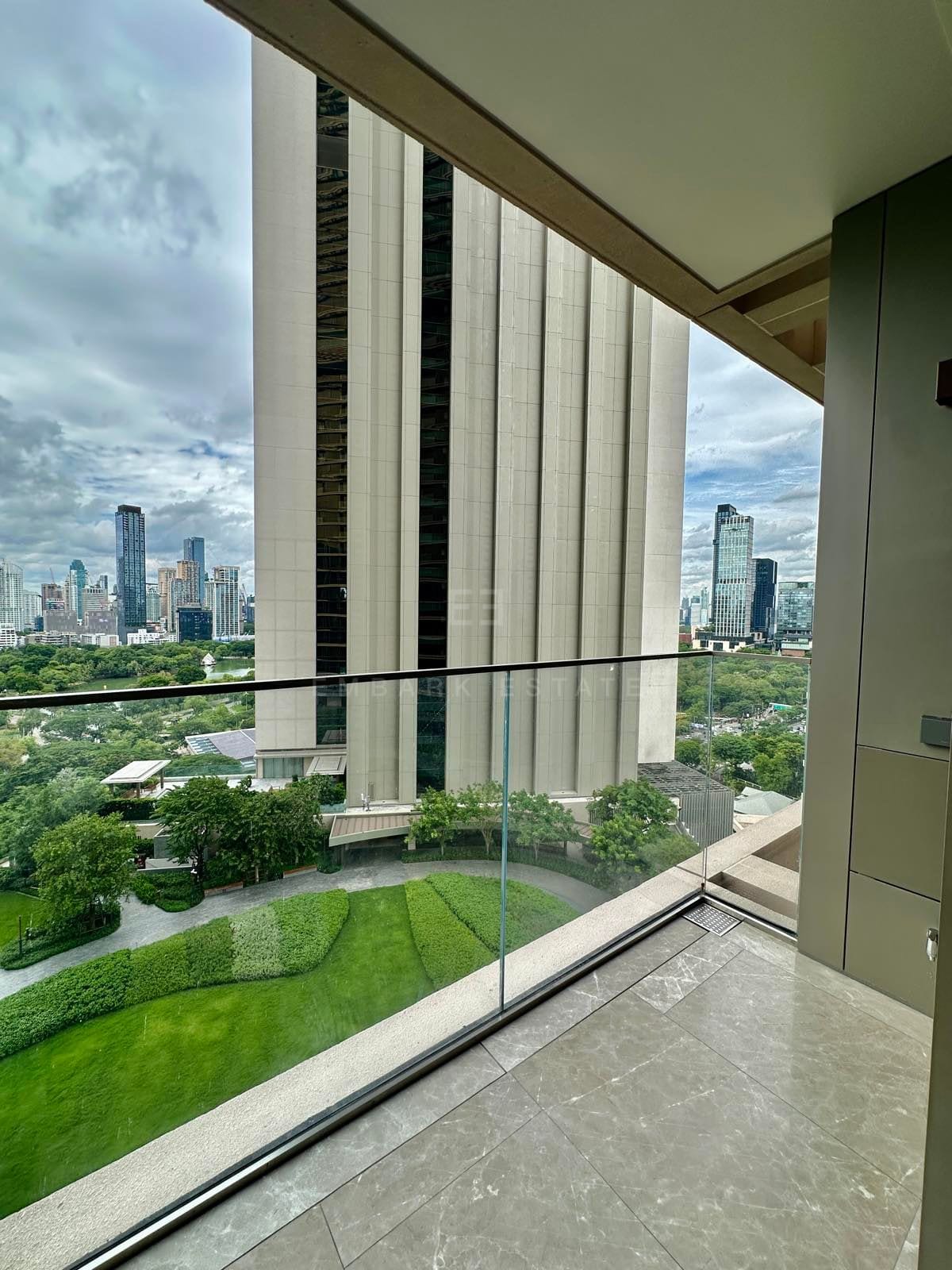 The balcony of a two-bedroom residence at Dusit Residences Parkside, Bangkok, looking down over the park