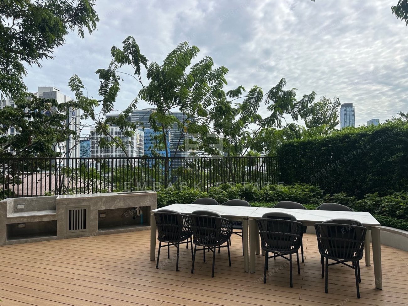 A garden terrace at Dusit Central Park with greenery and a central Bangkok view, home to Dusit Residences and Dusit Parkside on Rama IV Road