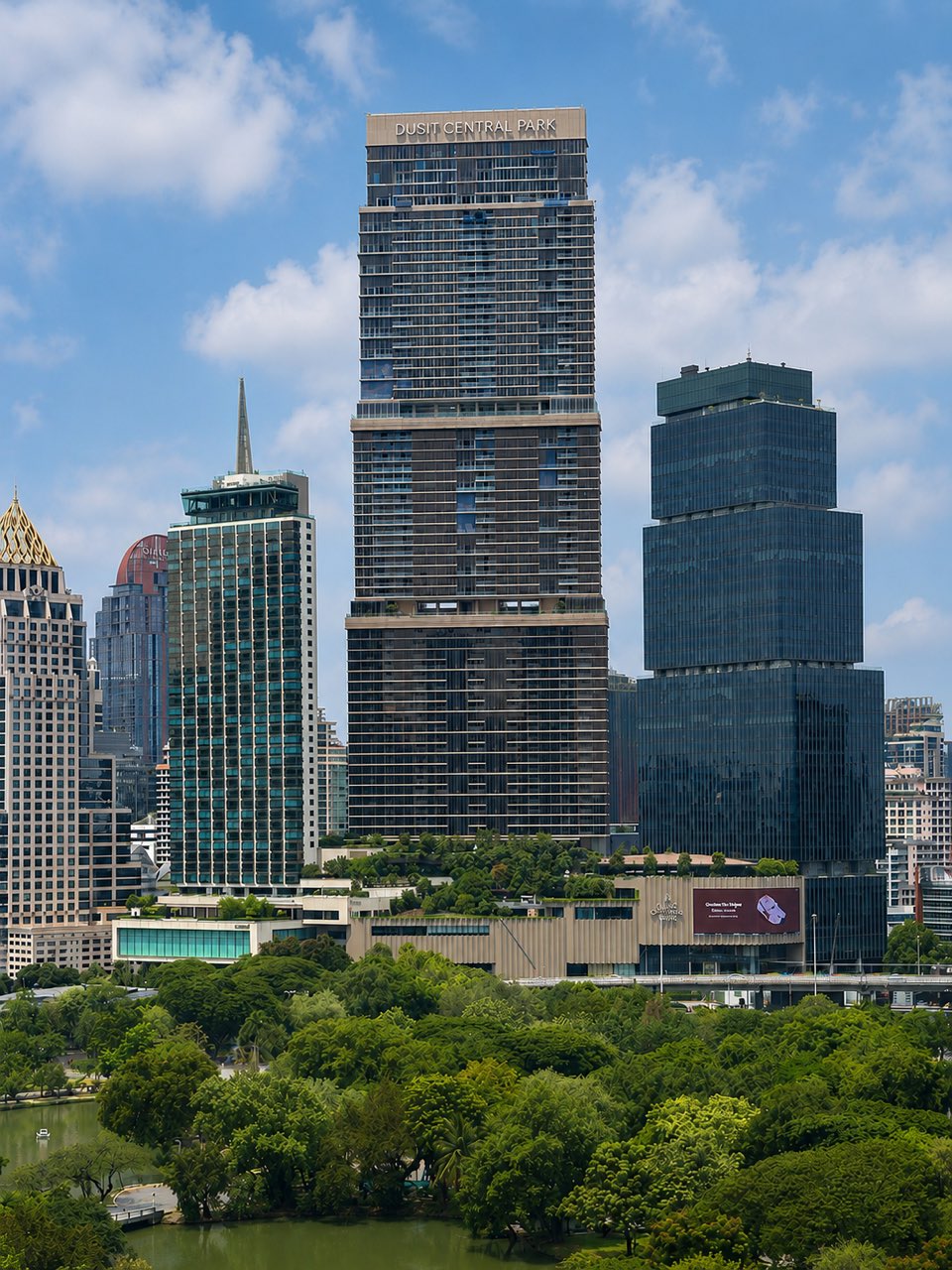The Dusit Central Park tower, home to Dusit Residences, rising above Lumphini Park on Rama IV in central Bangkok