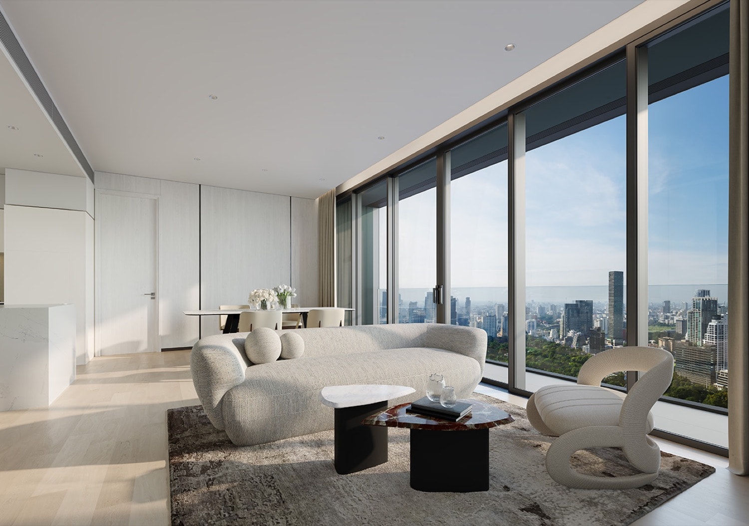 Living and dining room in an EI8HTEEN SEVEN residence at One Bangkok, with B&B Italia interiors