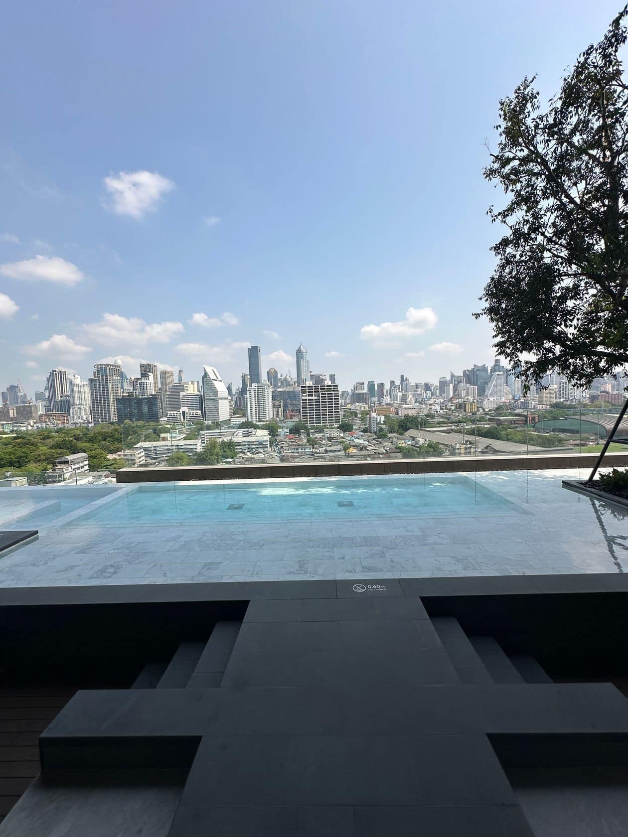 The poolside sun-loungers and cabanas at EI8HTEEN SEVEN, One Bangkok, above Lumphini Park