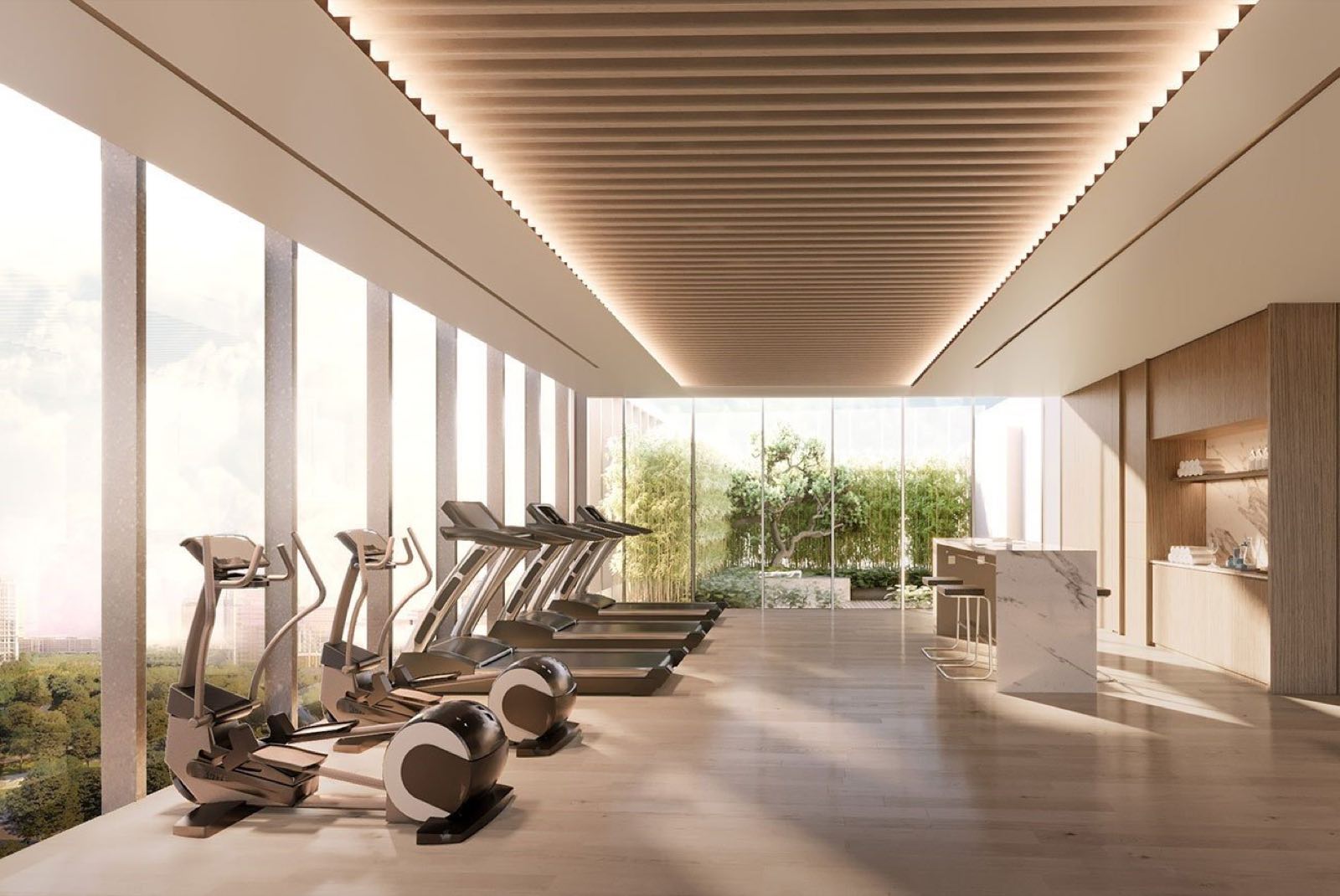 The Estelle Phrom Phong: fitness studio with treadmills overlooking a garden court