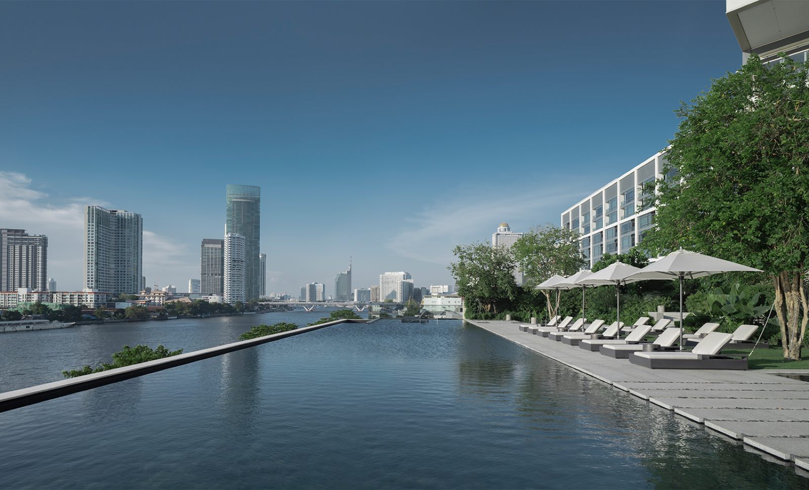 Four Seasons Private Residences Bangkok: riverside infinity pool deck with the residential building and Chao Phraya River