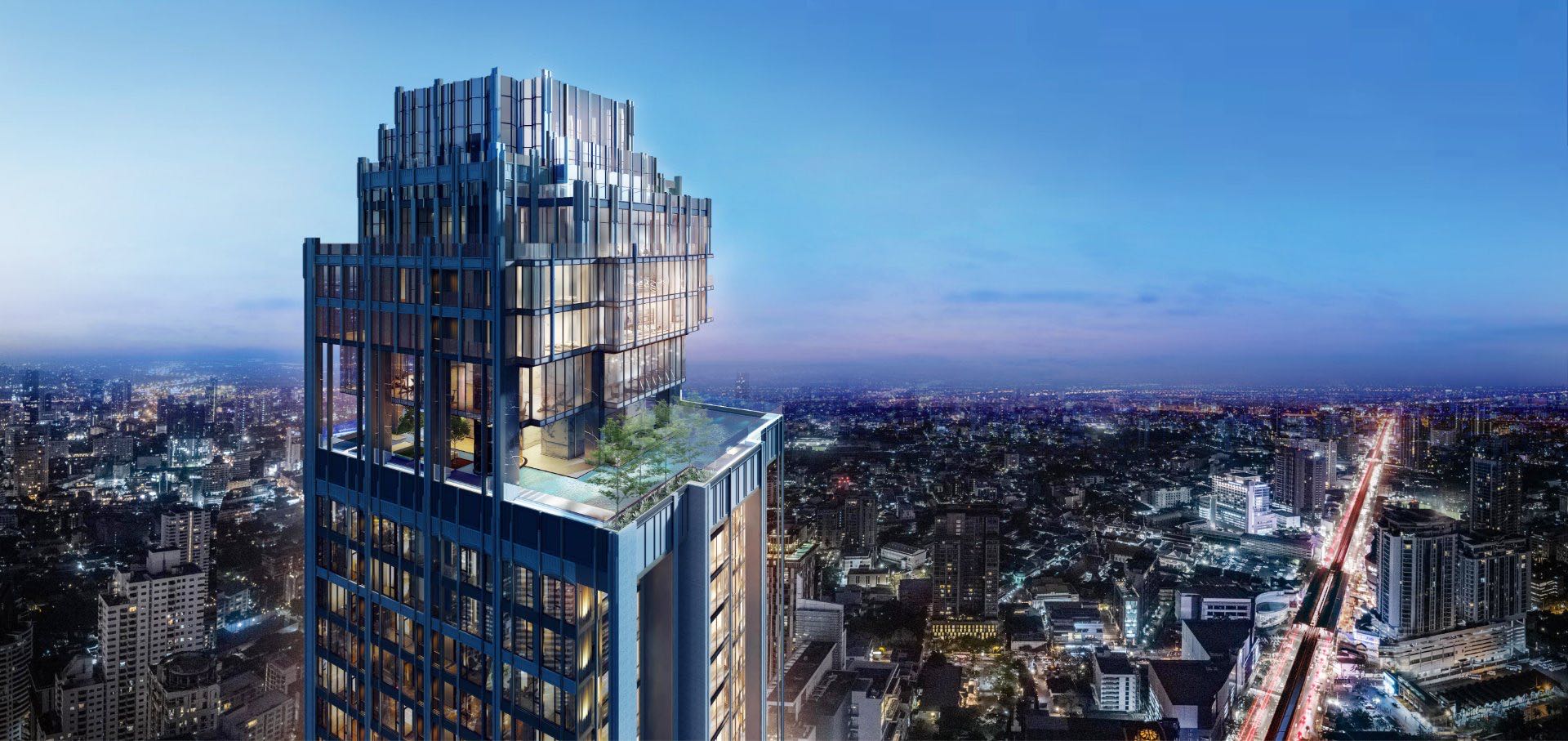 Hyde Heritage Thonglor: tower exterior at dusk above the Bangkok skyline