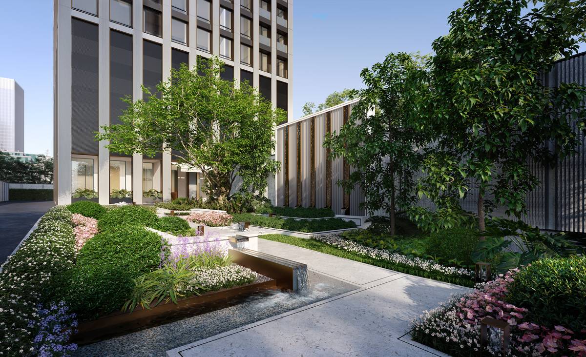 The garden at InterContinental Residences Bangkok Asoke: a timber deck and water channel set among flowering beds and mature trees at the foot of the tower, with the louvred podium wall behind, an artist's impression