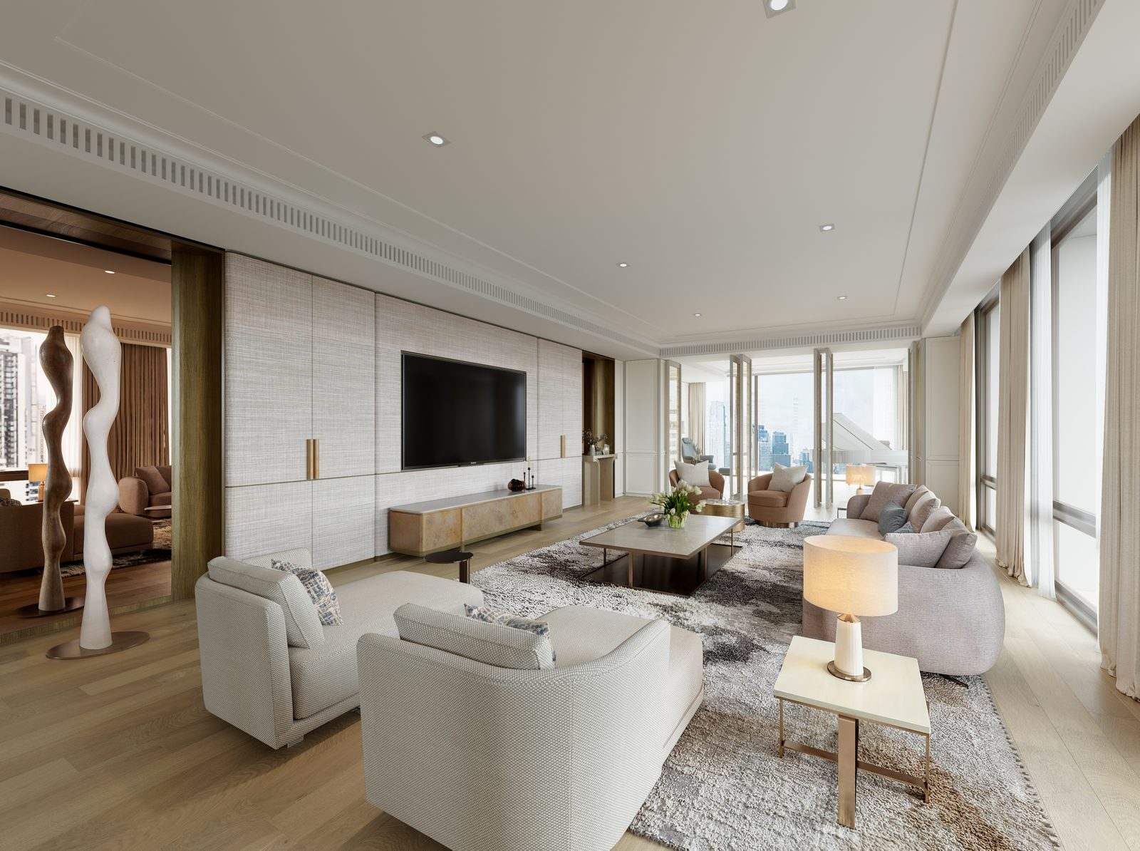 The sitting room, with a stone media wall, cream sofas on a patterned rug and corner glazing onto the city, a visualisation of the penthouse interiors at InterContinental Residences Bangkok Asoke, Sukhumvit 16, Bangkok