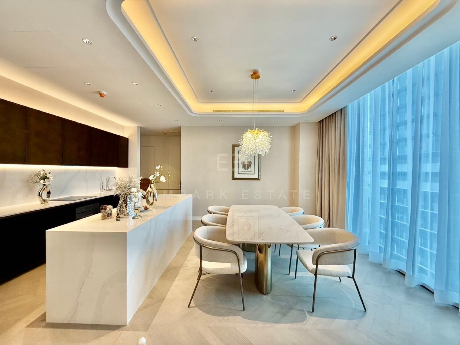 The open-plan living, dining and marble kitchen of a two-bedroom residence at ONE89 Wireless, One Bangkok
