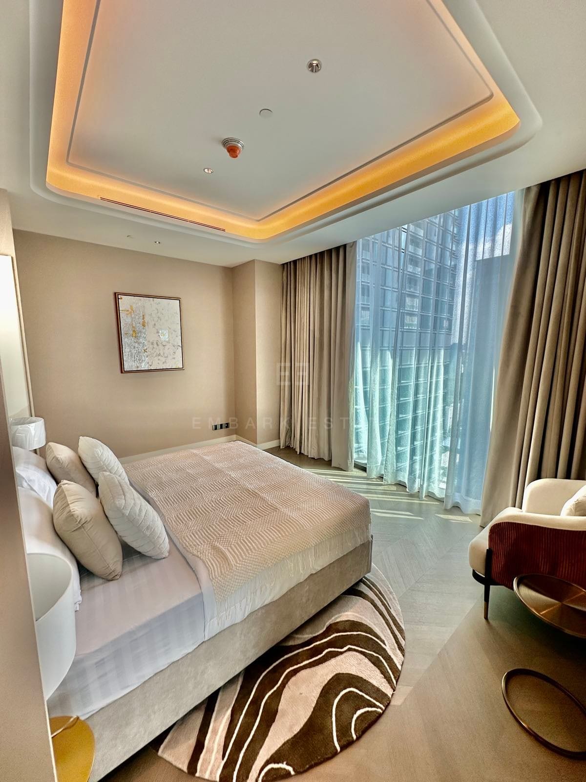 The principal bedroom of a two-bedroom residence at ONE89 Wireless, One Bangkok, with floor-to-ceiling windows