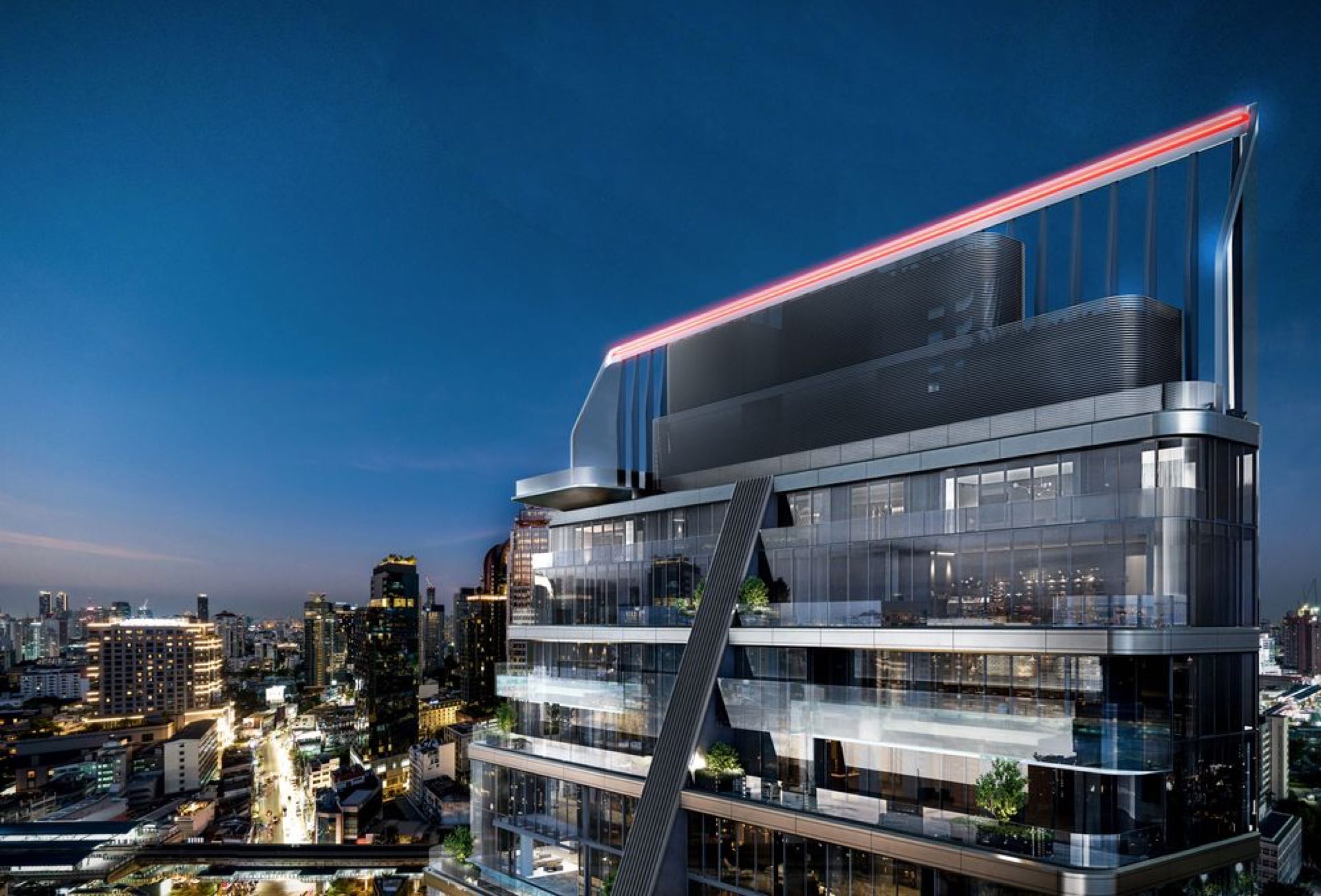 Porsche Design Tower Bangkok: Night view of the tower's upper floors and illuminated crown, showing the kinetic facade and the signature diagonal X-frame structural element against the Bangkok skyline