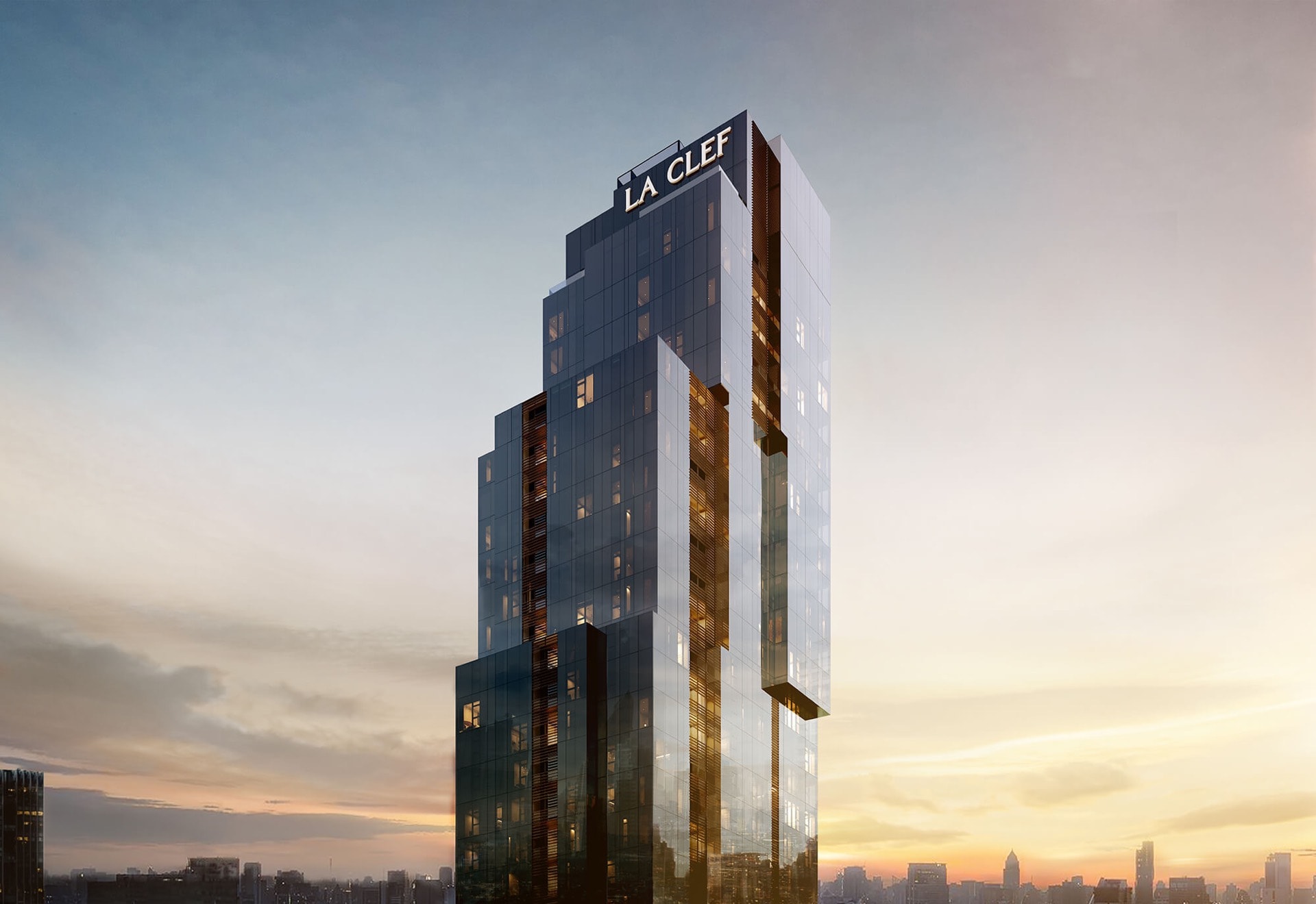 The Residences 38: Exterior render of The Residences 38 tower at sunset, a faceted glass high-rise topped by the La Clef serviced-residence sign