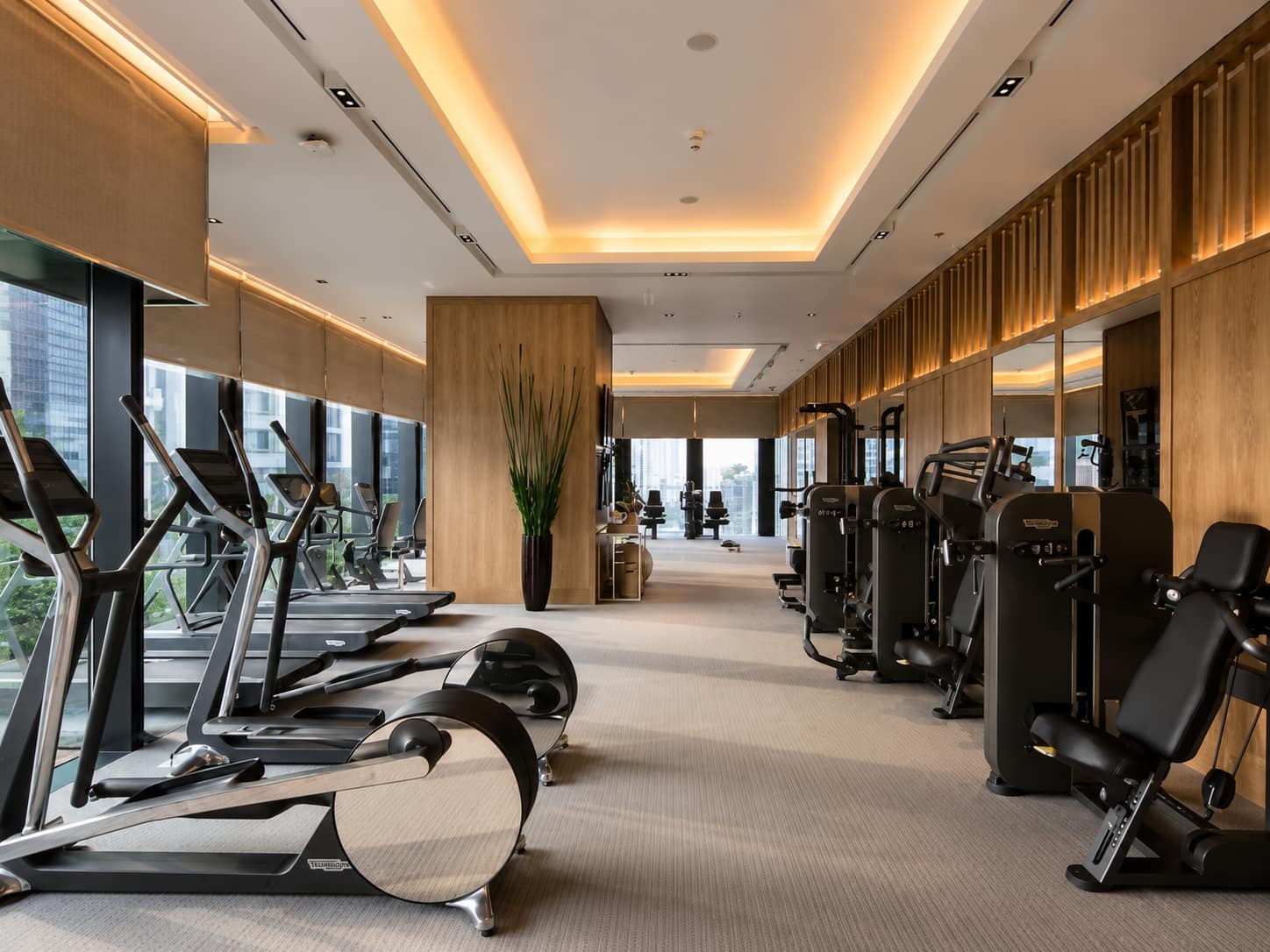 The Ritz-Carlton Residences Bangkok: the residents' fitness centre with Technogym equipment and floor-to-ceiling city views