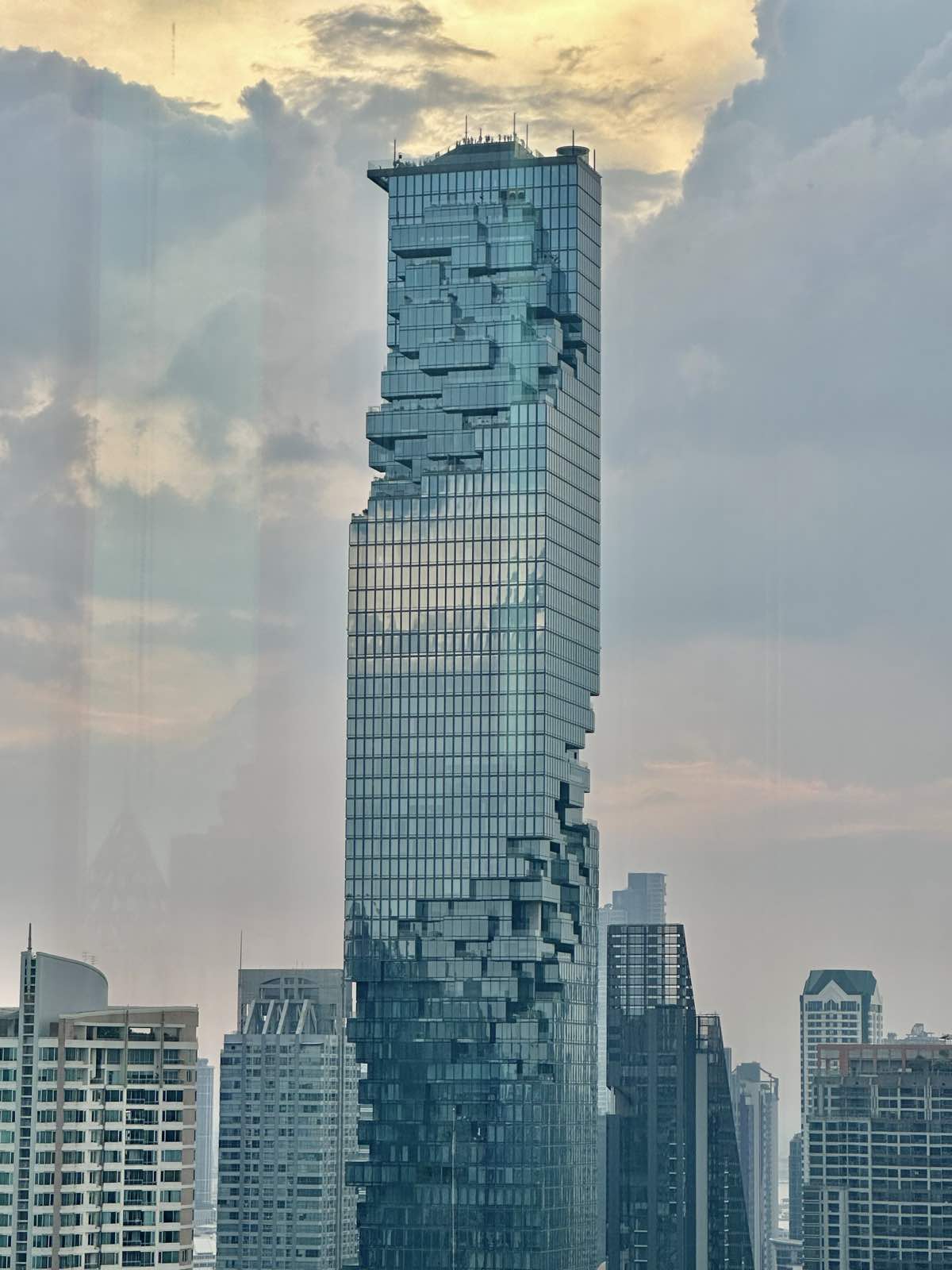 The Ritz-Carlton Residences Bangkok: the pixelated King Power MahaNakhon tower seen across the Bangkok cityscape