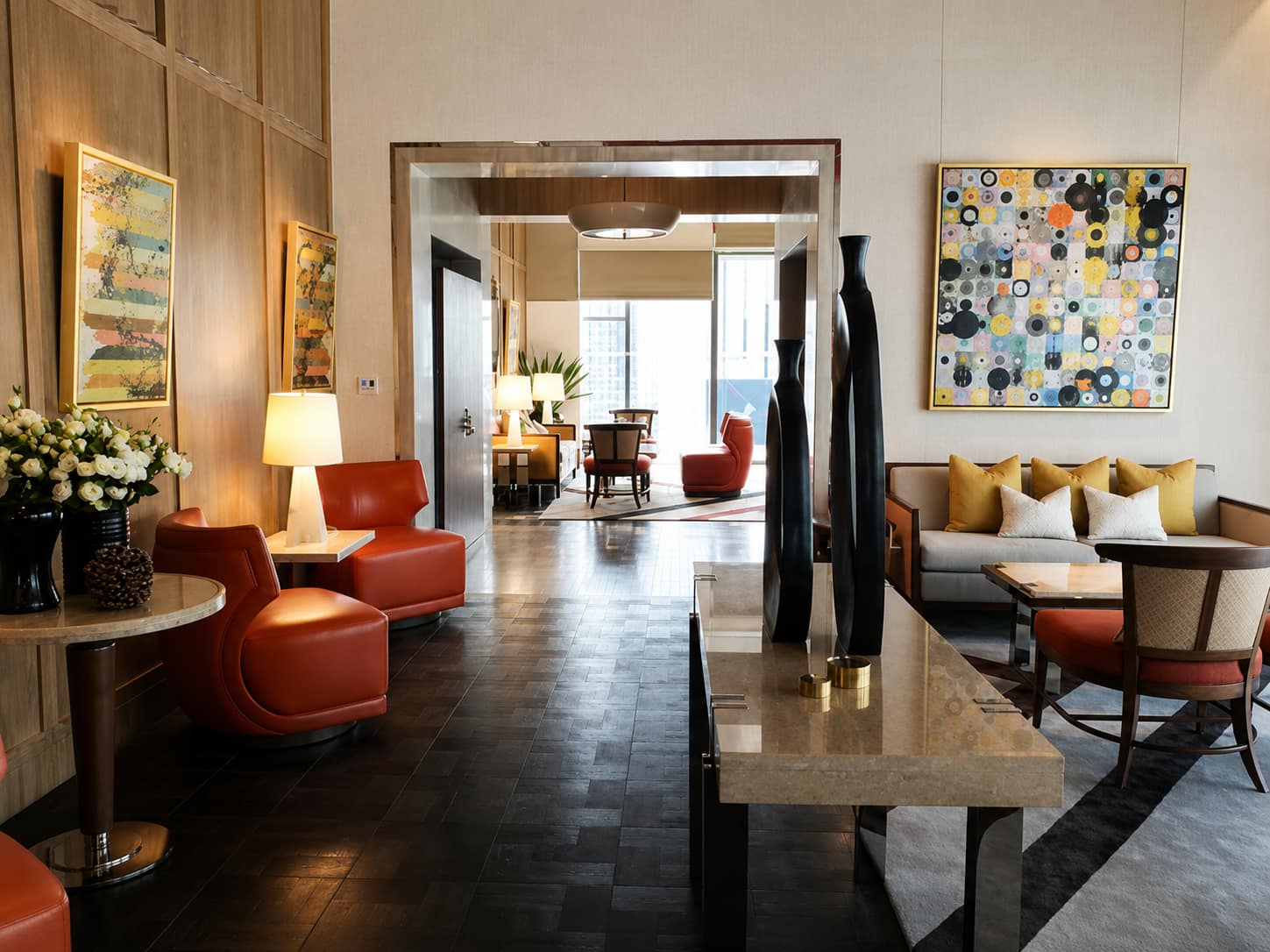 The Ritz-Carlton Residences Bangkok: the residents' lounge with red leather armchairs and contemporary art