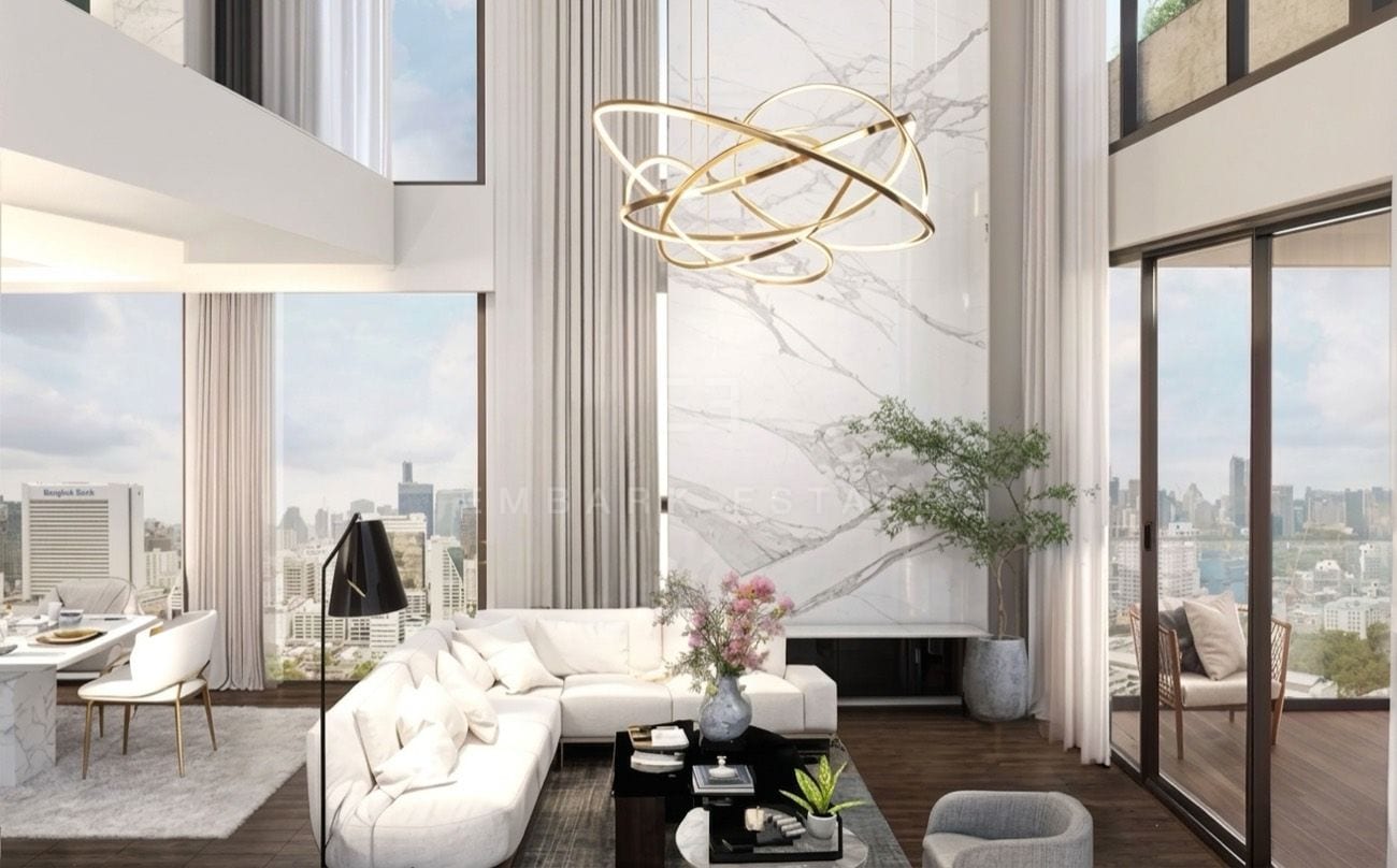 The double-height living room, with a full-height marble wall and a suspended ring light rising through both floors, an interior visualisation of the 419 sq.m four-bedroom duplex penthouse at ROMM Convent, Convent Road, Bangkok