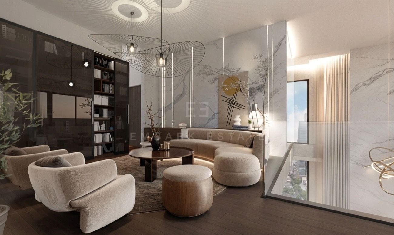 Sitting room with a curved sofa and built-in shelving below the mezzanine's glass balustrade, an interior visualisation of the 419 sq.m four-bedroom duplex penthouse at ROMM Convent, Convent Road, Bangkok