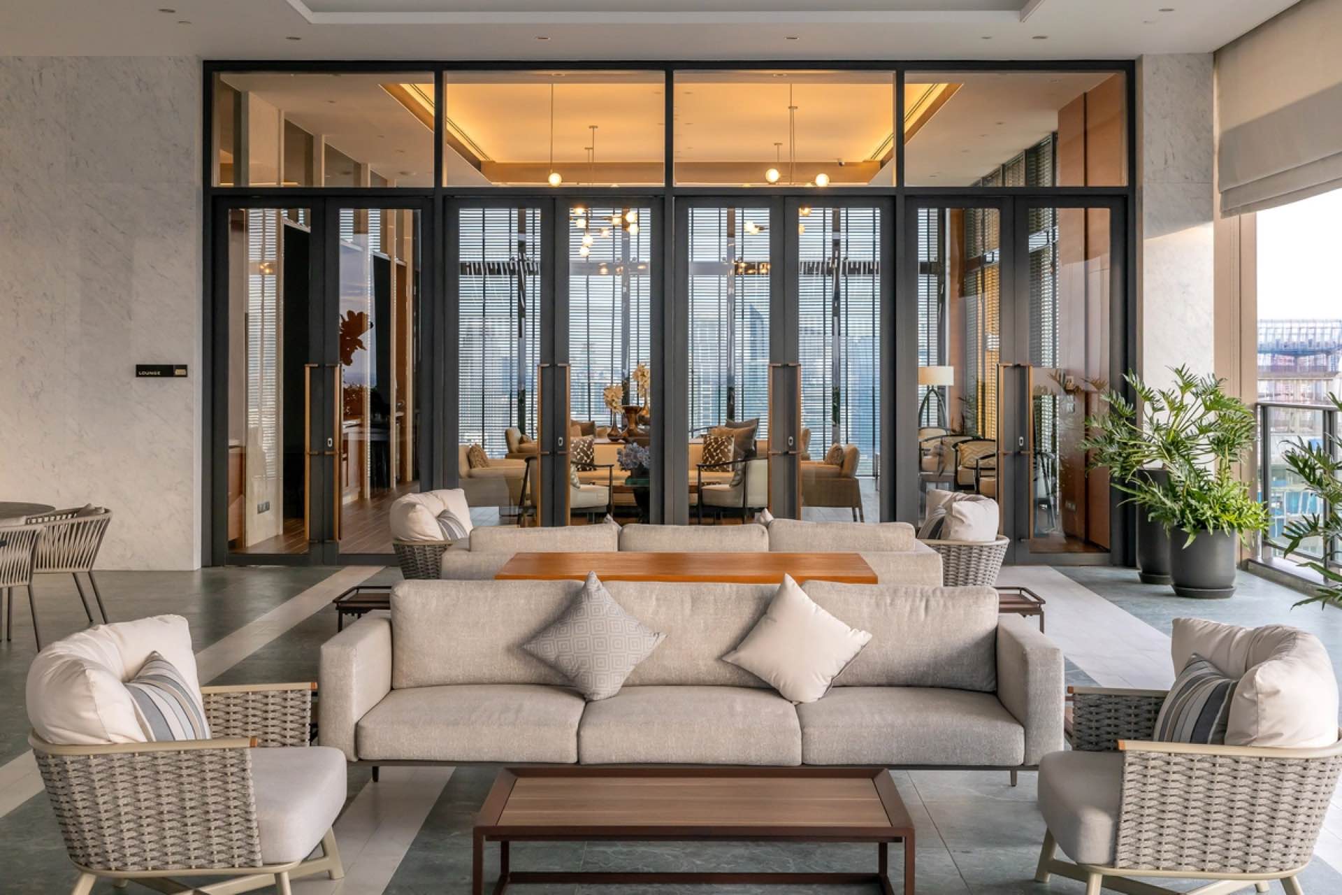 Arrival garden with a reflecting water feature at the base of The Residences at Sindhorn Kempinski, Bangkok