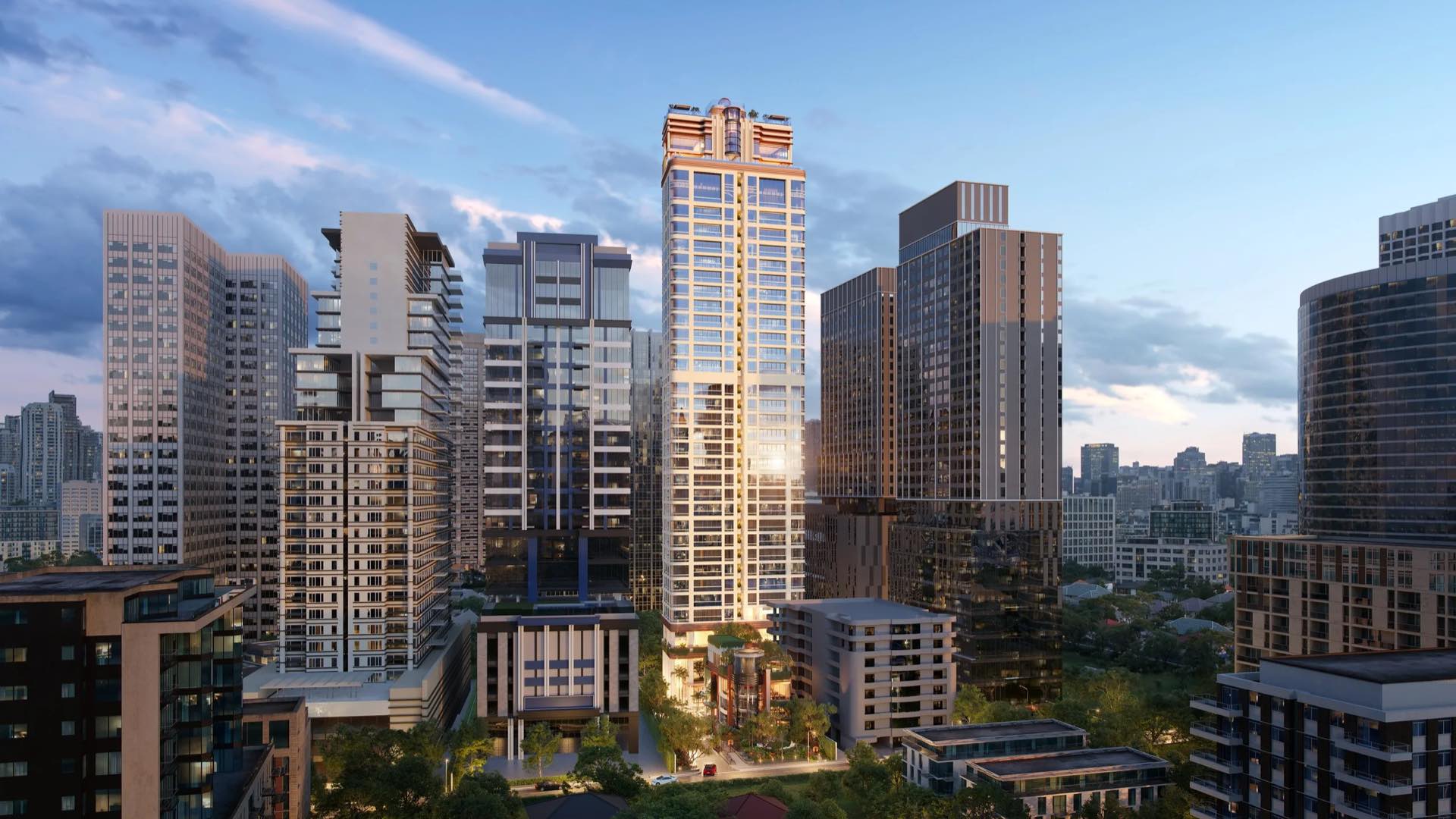 SLS Residences Bangkok Sukhumvit 24 ภาพมุมสูงของอาคารที่ตั้งตระหง่านท่ามกลางตึกสูงย่าน Sukhumvit ยามพลบค่ำ