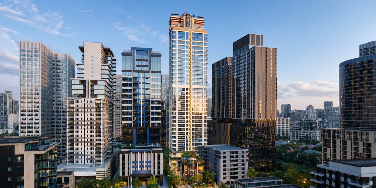 SLS Residences Bangkok Sukhumvit 24: the tower lit gold at dusk among the Sukhumvit 24 skyline in central Bangkok, an artist's impression