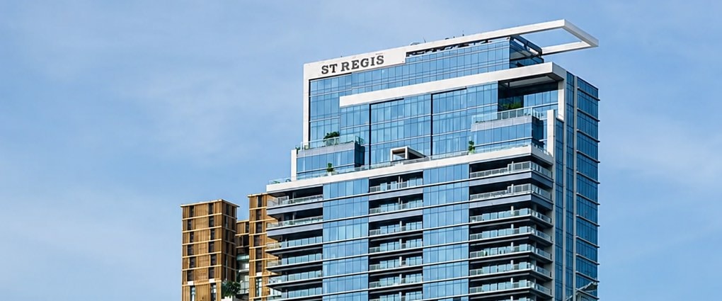 The crown of The Residences at The St. Regis Bangkok tower with the St. Regis name, on Ratchadamri Road in central Bangkok