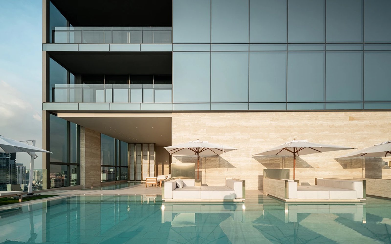 The Strand Thonglor: swimming pool terrace with cabanas and sun loungers