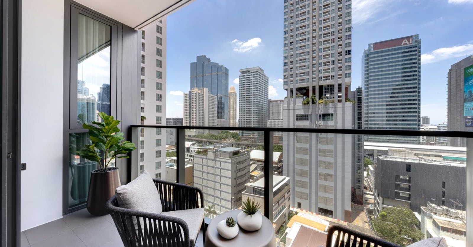 Tait Sathorn 12: ground-floor lobby and reception with marble desk and garden