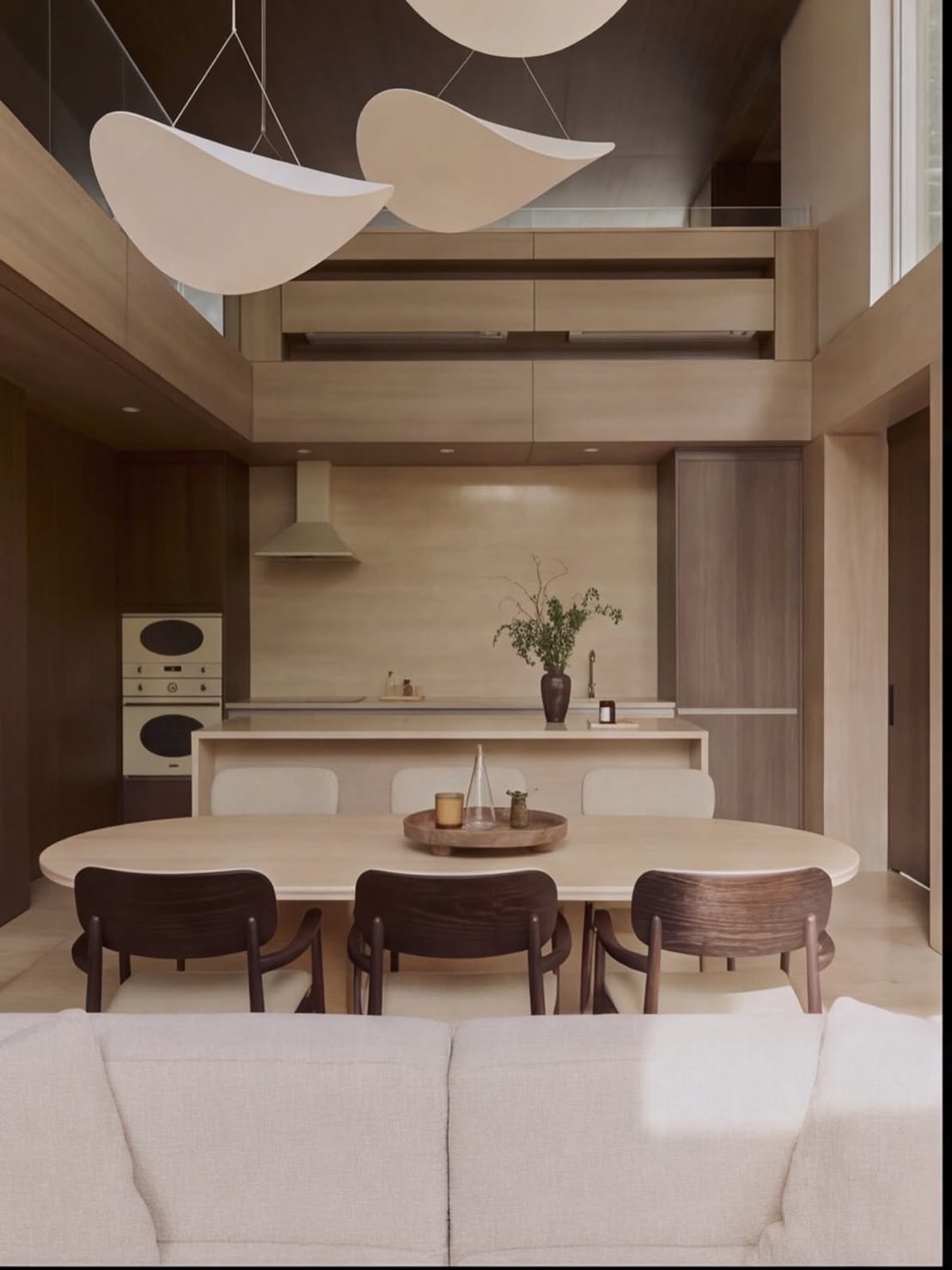 The kitchen and dining room below the mezzanine in the Type A show house at The Residenti Ekkamai, Bangkok